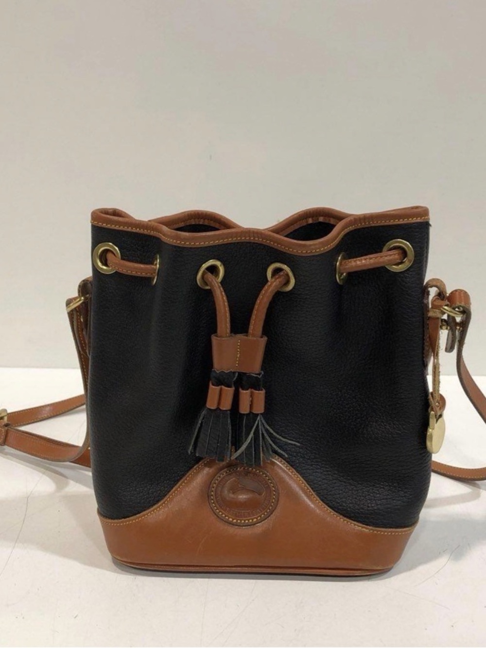 Small Dooney & Bourke Black and Brown Leather Drawstring Crossbody Bucket Bag